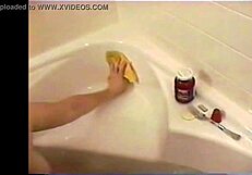 A blonde with beautiful breasts has fun with a cock and chocolate bath