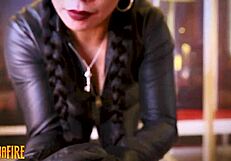 Skin tight leather gloves and high wooden heeled shoes in BDSM scene