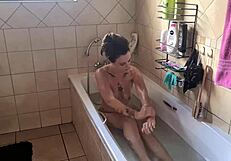 Small tits tattooed babe takes a bath