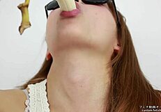 Japanese lesbian fetish video of woman licking banana and fake blowjob imagery