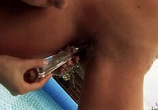 Two nice lesbians fuck in a pool with transparent fluke and fingering