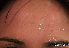 A beautiful woman takes facial ejaculation while sucking and fucking multiple men in a bukkake scene