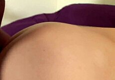 Aroused woman shows her naked skin to a tattooed black man