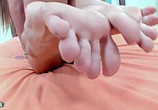 Succulent and wet Teen with not so big tits playing a foot job video
