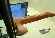 Randy slut performs deep throat with a fake cock