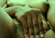 An older adult woman playing with herself with her fingers