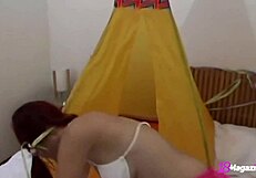 18-year-old natural-breasted redheaded Piper Fawn shows her talents in a montage video