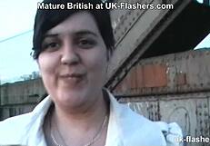 A public pub entertains a well endowed British woman
