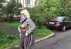 Young naked mature woman in tights shows her large breasts