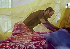 A very beautiful Indian woman spends passionate moments with her husband on the wedding night