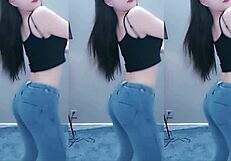Pretty Chinese girl shows off her sexy dance moves with a vibrator
