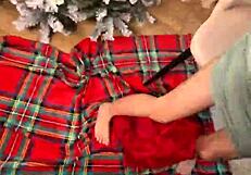 Housewife and husband have some fun during the holidays with Santa Claus.