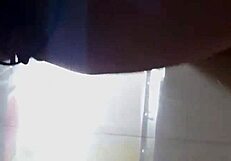 A beautiful woman strips and performs a risqué dance in the corridors of a hotel.