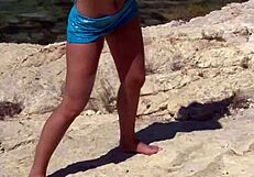 Beautiful girl strips on the beach