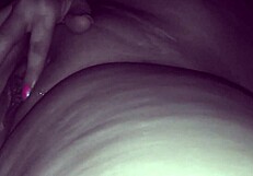 A woman having an orgasm with a gushing flow of pleasure while having sex with her husband.