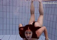 Hot Russian girl swims naked in the pool