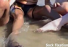 See how we get drenched in our stockings in this group fetish video.