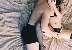 Beautiful woman with red hair seduces in cowgirl position