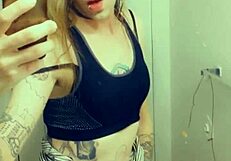 Pretty transgender in a miniskirt displaying her small penis and stimulating her clitoris