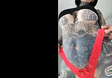 Melody Radford, a small tattooed woman performs a sexy dance