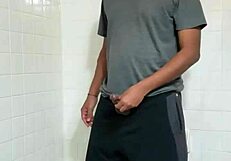 Horny hunk's solo performance in the bathroom is steamy