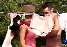Two blonde sluts get fucked in a 3some outdoors