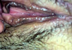 Amateur house video with a hairy and chubby girl spreading her wet pussy