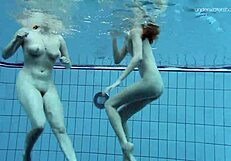 Anna Netrebko and Lada Poeschuk in an underwater shower scene