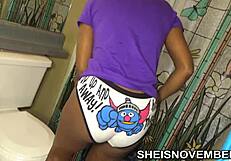 African American girl's slow undressing in the bathroom