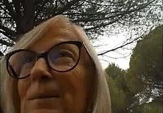 Mature blonde gets shocked while walking in the woods