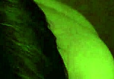 A young Russian woman gives oral sex to a man by sucking his penis and balls