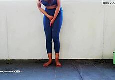 Asian beauty in leggings, desperate to pee on balcony