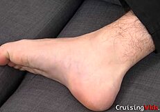 Gay man pleasuring himself by smelling his own feet