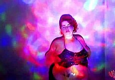 A BBW goddess performs a worship dance with oil
