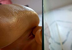 Belinda Selin enjoys solo shower pleasure with a dildo