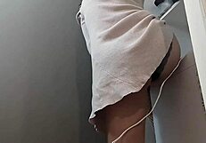 A curvaceous Japanese woman with large natural breasts and a nice ass gets horny while cleaning
