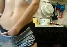 Skinny girl masturbates in the kitchen while parents watch