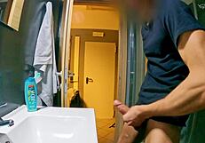 Public bathroom handjob in a gay hostel dorm