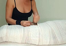 Mummified handjob with interruption and fetish play in video