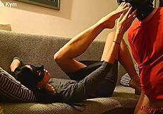 Mistress Kym's femdom scene includes nipple play and chastity tease