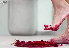 Solo girl enjoys foot fetish with crushed fruits and heels