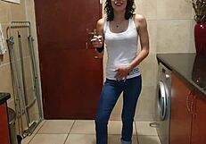 A lovely girl peed in her jeans and then began to smoke