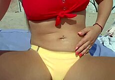 Blondie wanks her pussy on the beach and gets a bit too excited