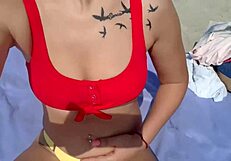 Blondie wanks her pussy on the beach and gets a bit too excited
