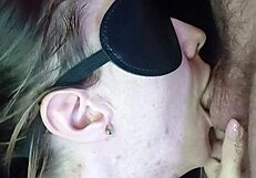 A girl sucks dick from the inside of the mouth, showcasing passionate close-ups