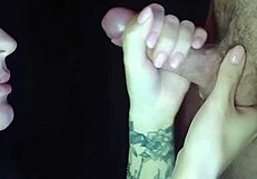 A girl sucks dick from the inside of the mouth, showcasing passionate close-ups