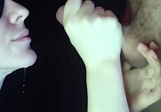 A girl sucks dick from the inside of the mouth, showcasing passionate close-ups
