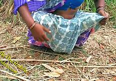 An Indian couple engaged in passionate sex right in the yard