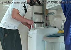 wow, the housewife is totally teasing the repair guy fixing her washing machine, isn't she wild?