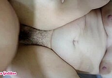 Curious goth milf with big ass and hairy pussy teases small tits while rubbing and fucking